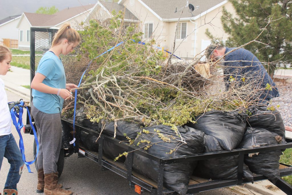 Kids helping secure another load from several different houses in Eagle Mountain.