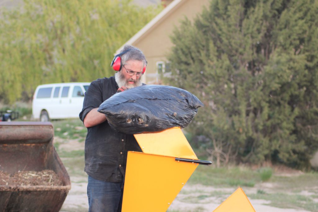 Shredding a bag of leaves.