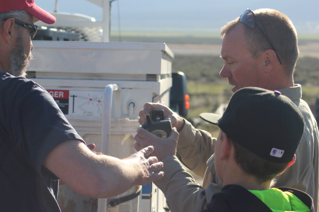 Brian and Lonny Read looking at the camera and working on the strategy to install it with little impact on the falcons.